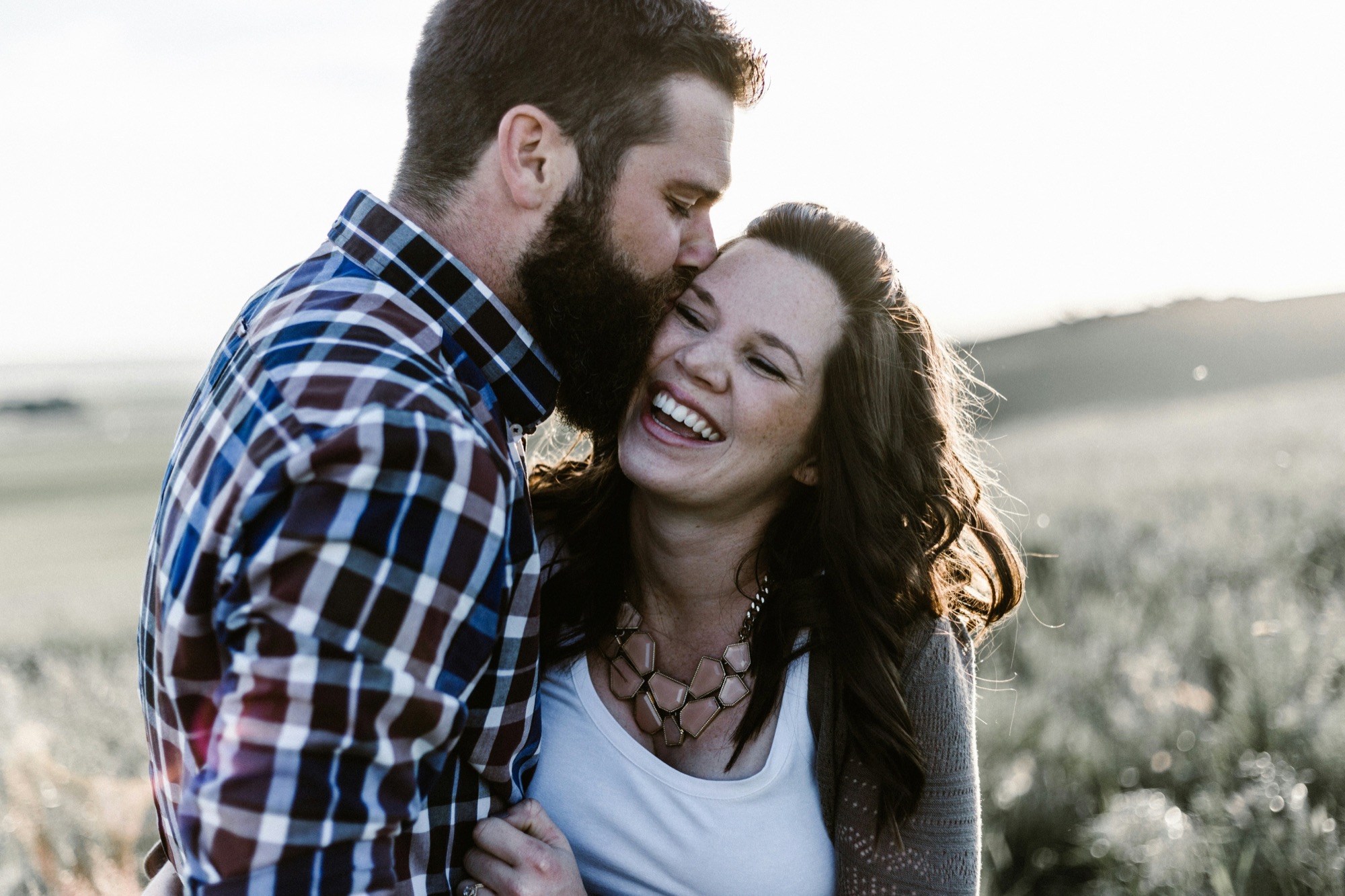 Joyful couple embracing outdoors — the kind of secure, connected relationship that relationship therapy in San Francisco can help build